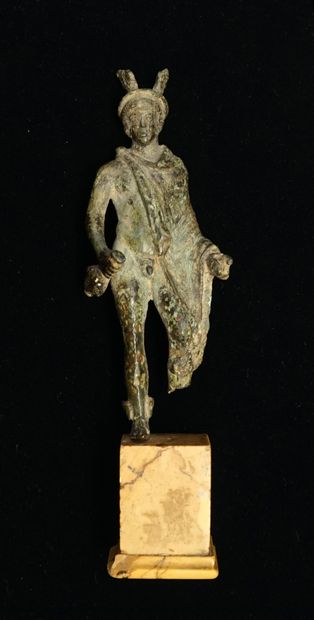 Mercury standing on a marble base. He is...