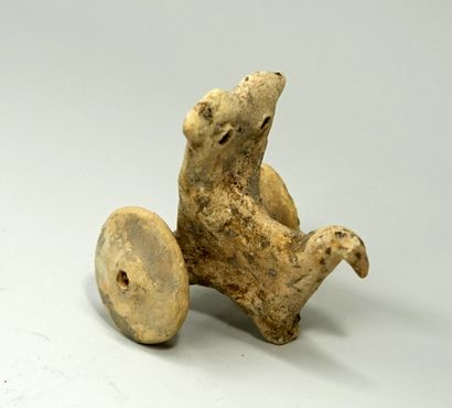 Statuette representing a stylized chariot....