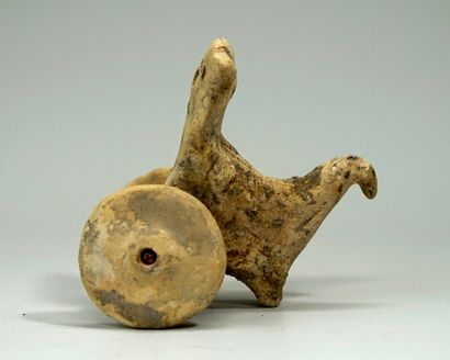 Statuette representing a stylized chariot....