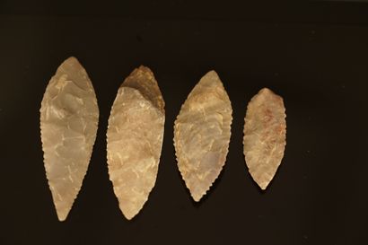 Four Neolithic laurel leaf flint arrowheads....