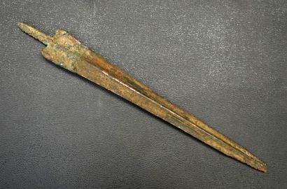 Bronze spear with green and brown patina....