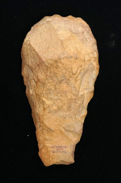 Brown flint biface (blunt point). Acheulean....