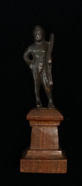 Hercules standing in bronze with brown patina....