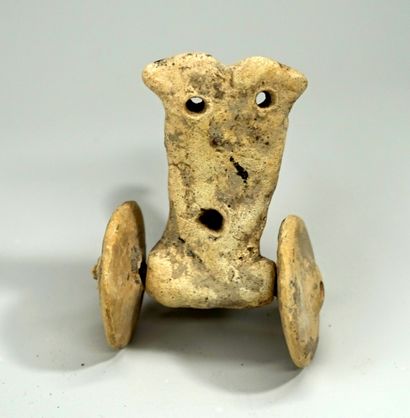 Statuette representing a stylized chariot....