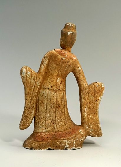 Richly dressed dancer in engobe clay. Tang...