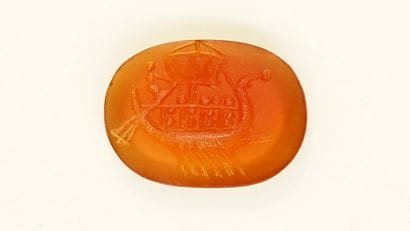 Intaglio showing a galley with a sail. Carnelian....