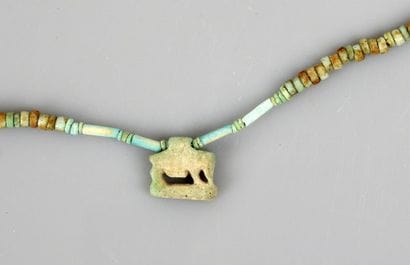 Mummiform necklace with an amulet representing...