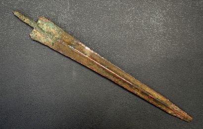 Bronze spear with green and brown patina....