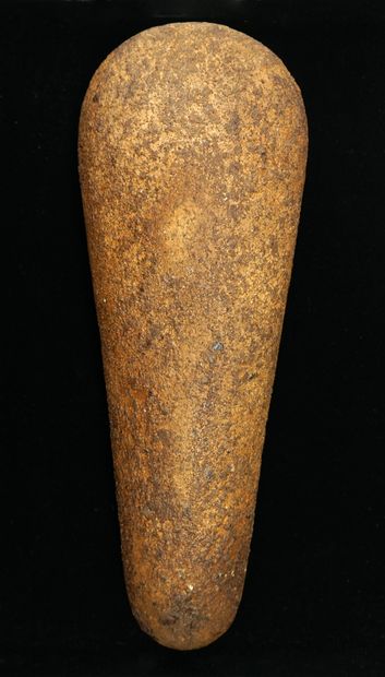 Important polished axe in brown/caramel sandstone,...
