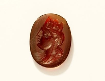 Intaglio showing a profile of a crowned woman....