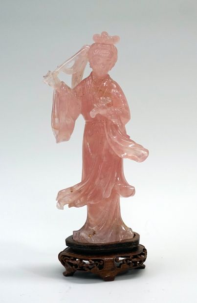 Rose quartz gwanyn holding fruits. China,...