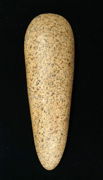 Polished axe in beige speckled stone with...