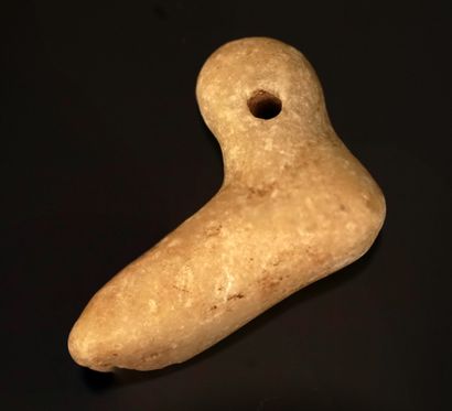 Amulet pierced in the shape of a foot. White...