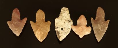 Five Neolithic long-stalked flint arrowheads....