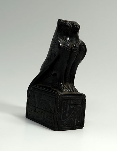 Museum casting: Horus falcon on a base inscribed...