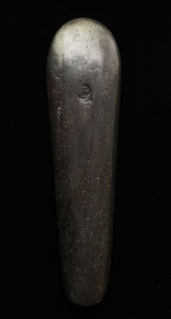 Beautiful polished axe in black stone slightly...