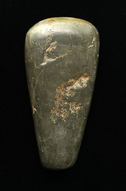 Polished axe in green stone. (a few chips...