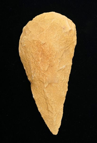 Almond-shaped biface in light beige quartzite....