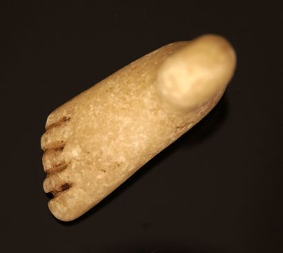 Amulet pierced in the shape of a foot. White...