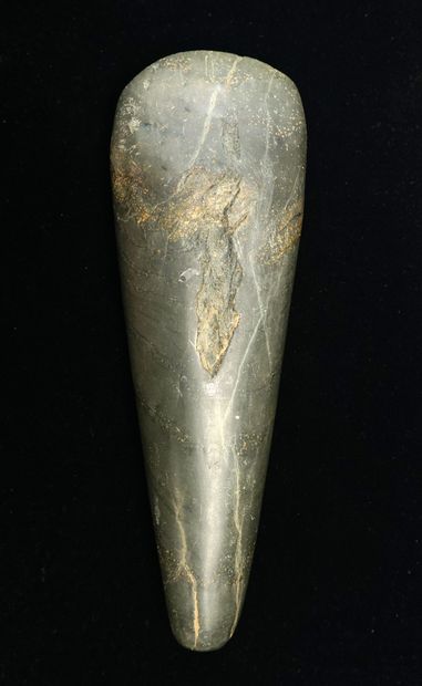 Beautiful polished axe in green stone. (a...