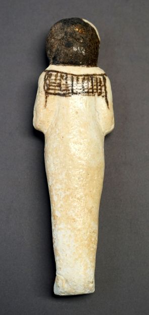 Oushebti en faience blanche de style égyptien...