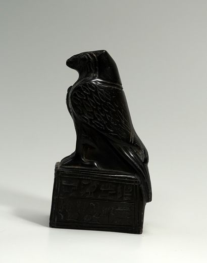 Museum casting: Horus falcon on a base inscribed...