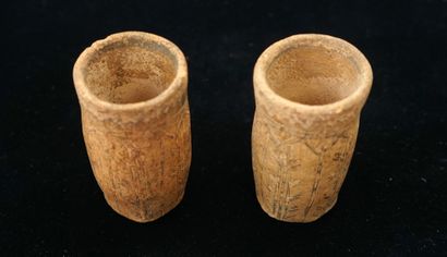 Two terracotta cups decorated with painted...