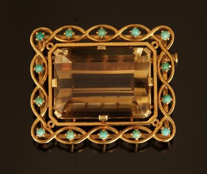 18k (750/°°) yellow gold brooch centered...