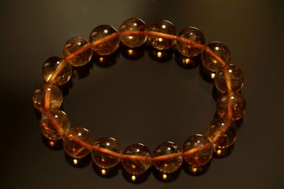 BRACELET composed of round citrine beads,...