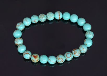 BRACELET composed of round turquoise beads,...