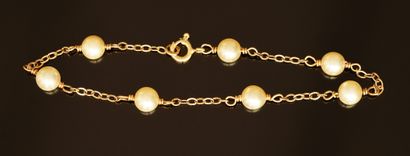 BRACELET in 18k (750/°°) yellow gold alternated...