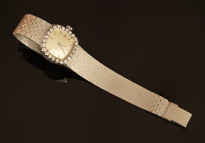 WATCH in 18K (750/°°) white gold, dial surrounded...
