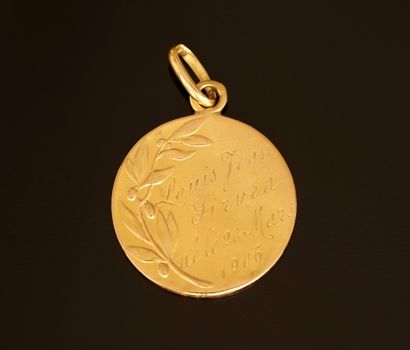 Religious medal in yellow gold 18k (750/°°)....