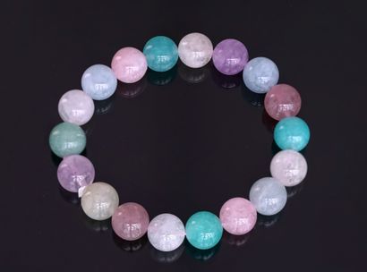 BRACELET composed of round beads of aquamarine,...
