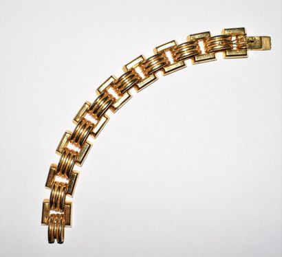 BRACELET in 18K (750/°°) yellow gold, tank...