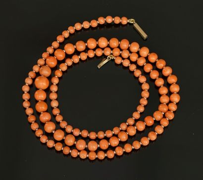 SAUTOIR of round coral beads in fall from...