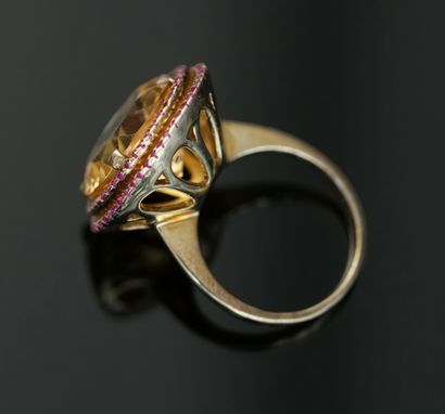 Gilded silver ring centered on a round faceted...
