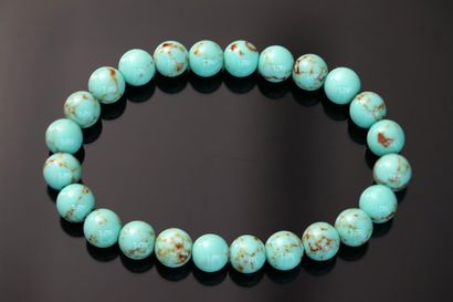 BRACELET composed of round turquoise beads,...