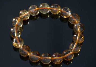 BRACELET composed of round citrine beads,...