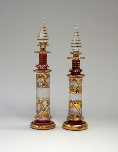 2 perfume jars in transparent and pink blown...