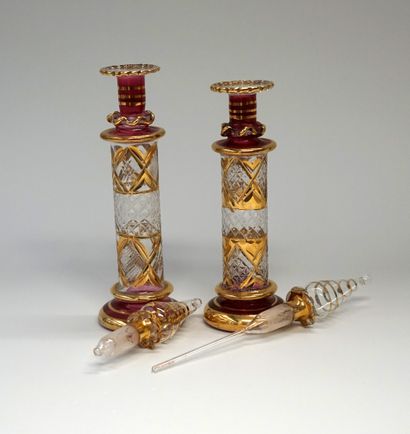 2 perfume jars in transparent and pink blown...