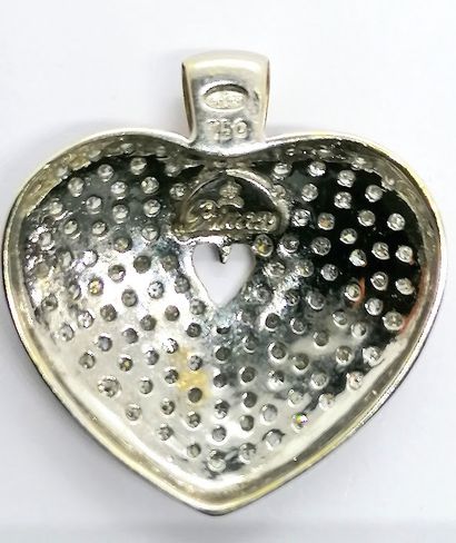 
PENDENTIF en or blanc 18K (750/°°) figurant...