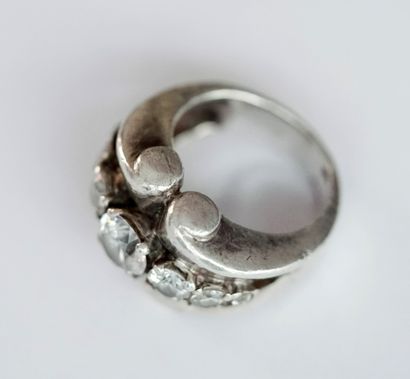 Silver roll ring set with a line of white...