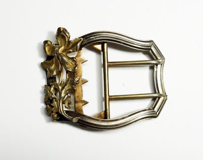 Silver belt buckle with iris design, circa...