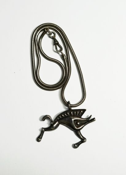 Silver-plated metal chain holding a Celtic...
