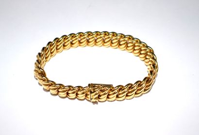 BRACELET in 18K (750/°°) yellow gold, American...