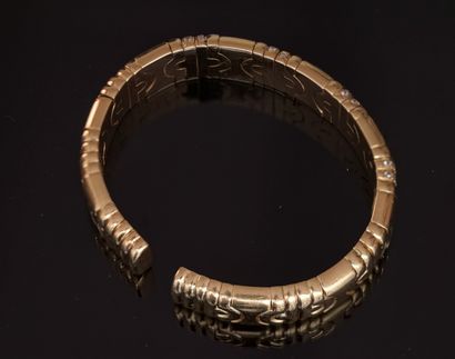 18K (750/°°) yellow gold open rigid BRACELET...