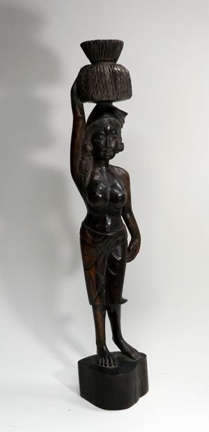 Female statue in exotic wood with basket...