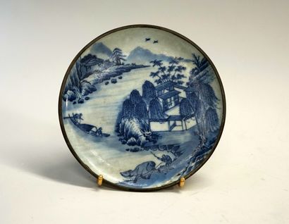 Plate in blue white porcelain decorated with...
