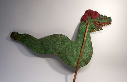 Old puppet presenting the green Naga from...